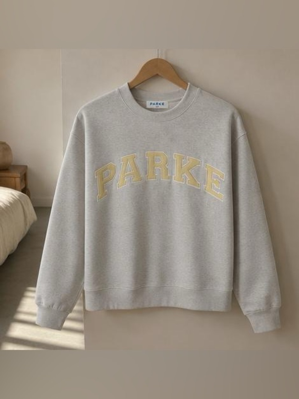 Parker Light Gray Crewneck Sweatshirt with Pale Yellow Appliqué